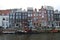 canal and brick habitation buildings - amsterdam - netherlands
