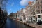 canal and brick habitation buildings - amsterdam - netherlands