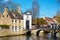 Canal and bridge view, St. Elisabeth Church entrance in Brugge, Belguim