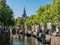 Canal and church tower in Gouda, Holland