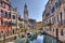 Canal and church tower in Venice, Italy