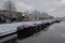 Canal in the city of Ghent with living boats on a winter day with snow