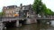 Canal crossing in Amsterdam typical view City of Amsterdam