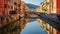 Canal Flows Between Houses And Buildings In Italy