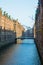 Canal in the historic Speicherstadt warehouse district in the ci