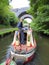 Canal narrowboat going under bridges