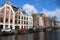 canal and old brick habitation buildings in amsterdam - the netherlands