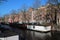 canal and old brick habitation buildings - amsterdam - netherlands