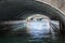 A canal passes under a bridge in Copenhagen, Denmark