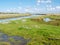 Canal in salt marsh near Kobbeduinen on Schiermonnikoog island, Netherlands