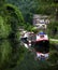 Canal Scene near Hebden Bridge Halifax showing barges and tree lined waterway.