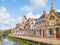 Canal and tower of church in old town of Bolsward, Friesland, Ne