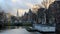 Canal and townhouses, The Waag in the background, Amsterdam, Netherlands