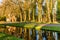 Canal and trees at entrance of in Veenhuizen in The Netherlands