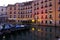 Canal in Venice with docked gondola and boats