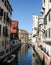 Canal in Venice with floating gondola