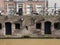 Canal wall with shutters and windows on plompetoren gracht in old center of utrecht in the netherlands