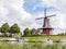 Canal and windmill on fortifications of fortified town of Dokkum, Friesland, Netherlands