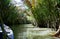 The canals in the Mekong Delta are surrounded by jungles and mangroves. Vietnamese rowing boats on canal waters