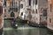 Canals of Venice. Gondolas rolling tourists, reflections of colorful buildings in the water. Processing in the style of drawing
