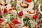 Canape appetizers with strawberries and Brie soft cheese