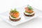 Canape with cheese, cucumber and salted salmon