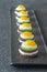 Canape with fried quail eggs