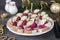 Canape with salted herring, beetroot mousse and cucumber on white bread toasts, Close-up