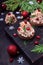 Canape shaped as a Christmas tree with pate garnished with pomegranate and dill