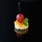 Canape with toast bread, cheese and grapes on a black background. Copy space. Concept for food, snacks, menu, restaurant, catering