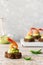 Canapes with avocado mousse and spicy shrimp on brown bread