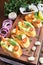Canapes with avocado and squash caviar and garlic shrimps on crispy bread. A simple and light snack for parties and banquets.
