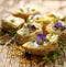 Canapes with eddible flowers and broad bean hummus