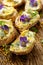 Canapes with eddible flowers and broad bean hummus