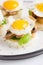 Canapes with fried mushrooms, quail egg, soft cheese and basil,