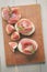 Canapes with jamon and figs on table