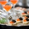 Canapes with red caviar and black caviar on a serving tray, close up. Gourmet food, delicacy appetizer, luxury seafood. Texture of