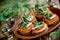 Canapes with rye bread, salted herring fillet, mustard, onion, tomato