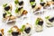 Canapes with salmon, olives and garlic butter