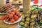 Canapes from tomatoes surrounded by different foods