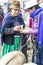 Canar, Ecuador - July 12, 2015 - A woman hands over cash to purchase sheep