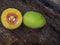 Canarium subulatum, Burseraceae,plant fruit on the old wooden background.The wild local fr