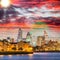 Canary Wharf night skyline with Thames river reflections, London