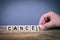 Cancel, wooden letters on the office desk