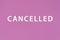 CANCEL word made with building blocks, business concept. Word CANCEL on pink background. Event cancellation. Cancelled