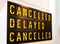 Canceled, delayed, canceled sign text letters words timetable