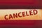 Canceled type message on red and white grunge wood