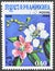 Cancelled postage stamp printed by Cambodia, that shows Plumeria sp