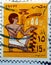 A cancelled postage stamp printed in Egypt features a slave bearing votive fruit offering, mural, circa 1985