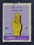 Cancelled postage stamp printed by Lebanon, that shows Hand making Scout sign